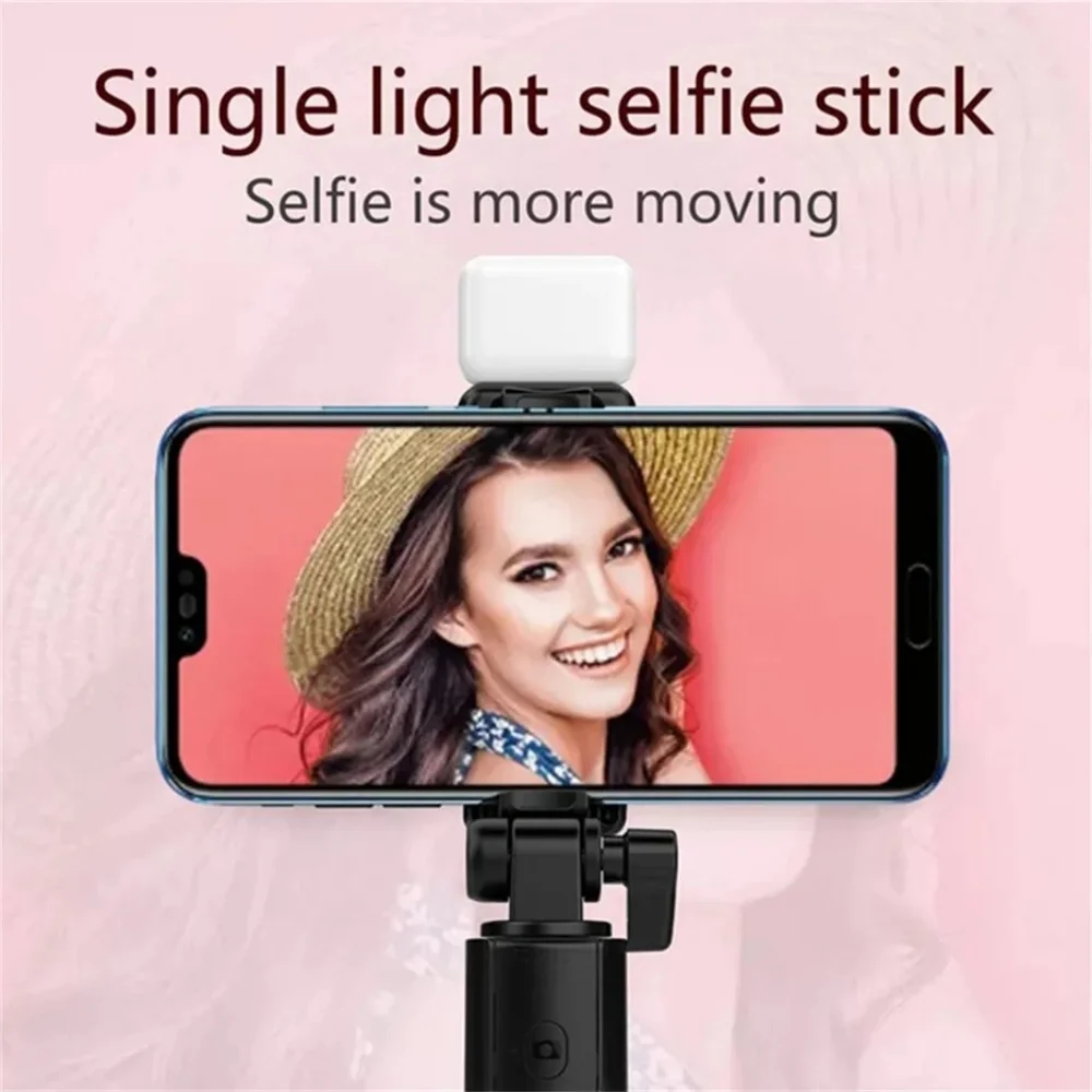 Adjustable length selfie stick with light and remote